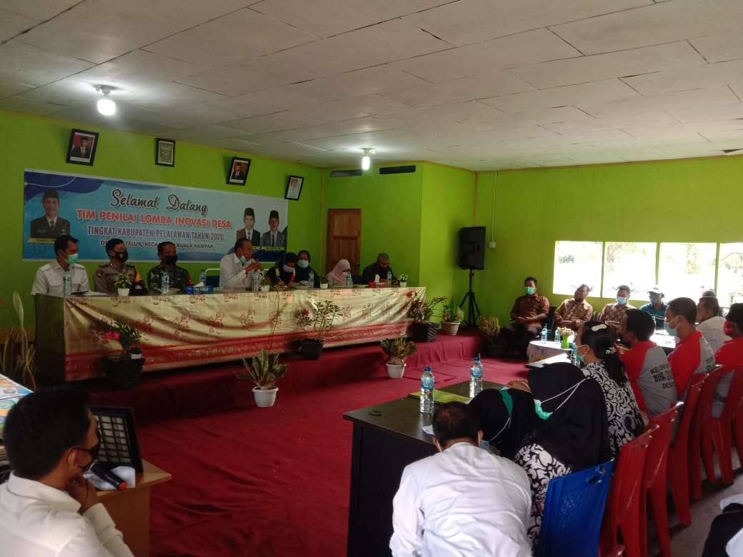 Personel Polsek Kuala Kampar Hadiri Penilaian Lomba Inovasi Desa di Desa Teluk