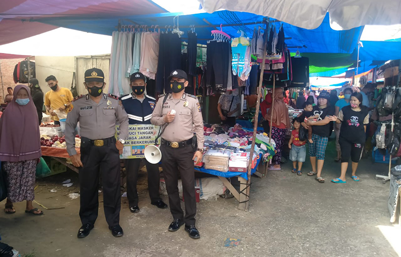 Disiplinkan Protokol Kesehatan, Polsek Bandar Sei Kijang Gelar Operasi Yustisi di Pasar