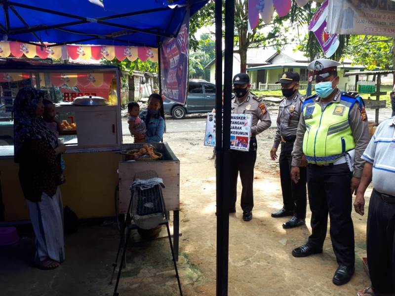 Imbau Warga Patuhi Prokes, Polsek Bandar Sei Kijang Sambangi Desa Simpang Beringin