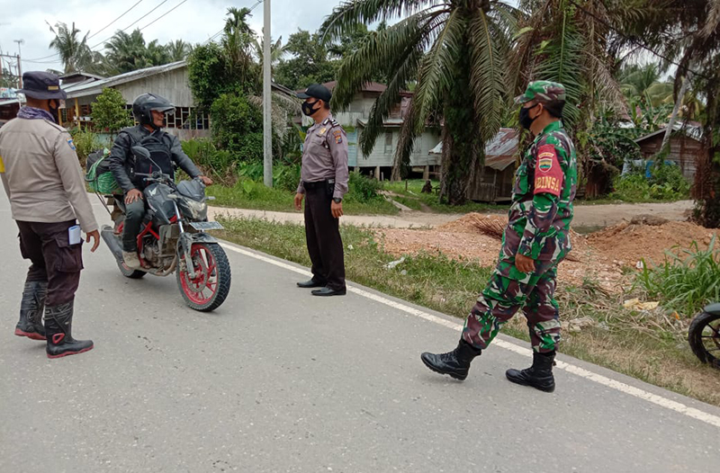 Polisi Langgam Optimalkan Razia Masker di Pos PPKM
