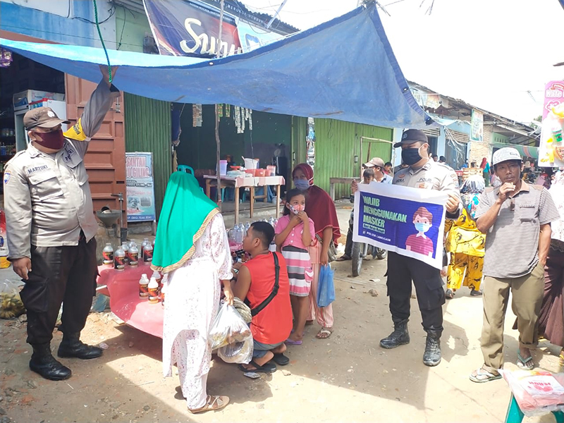 Personel Polsek Langgam Patroli C3 dan Sosialisasi Antisipasi Penyebaran Covid-19