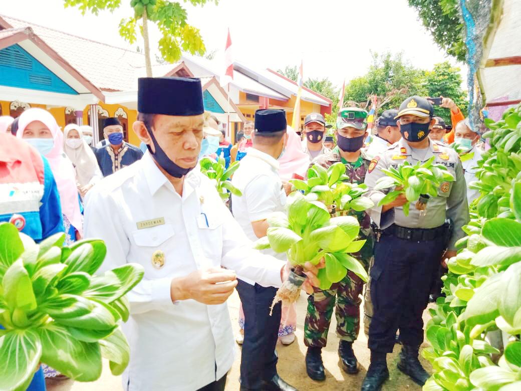 Kapolsek Kerumutan dan Upika Hadiri acara Penandatangan MoU Kampung Proklim 