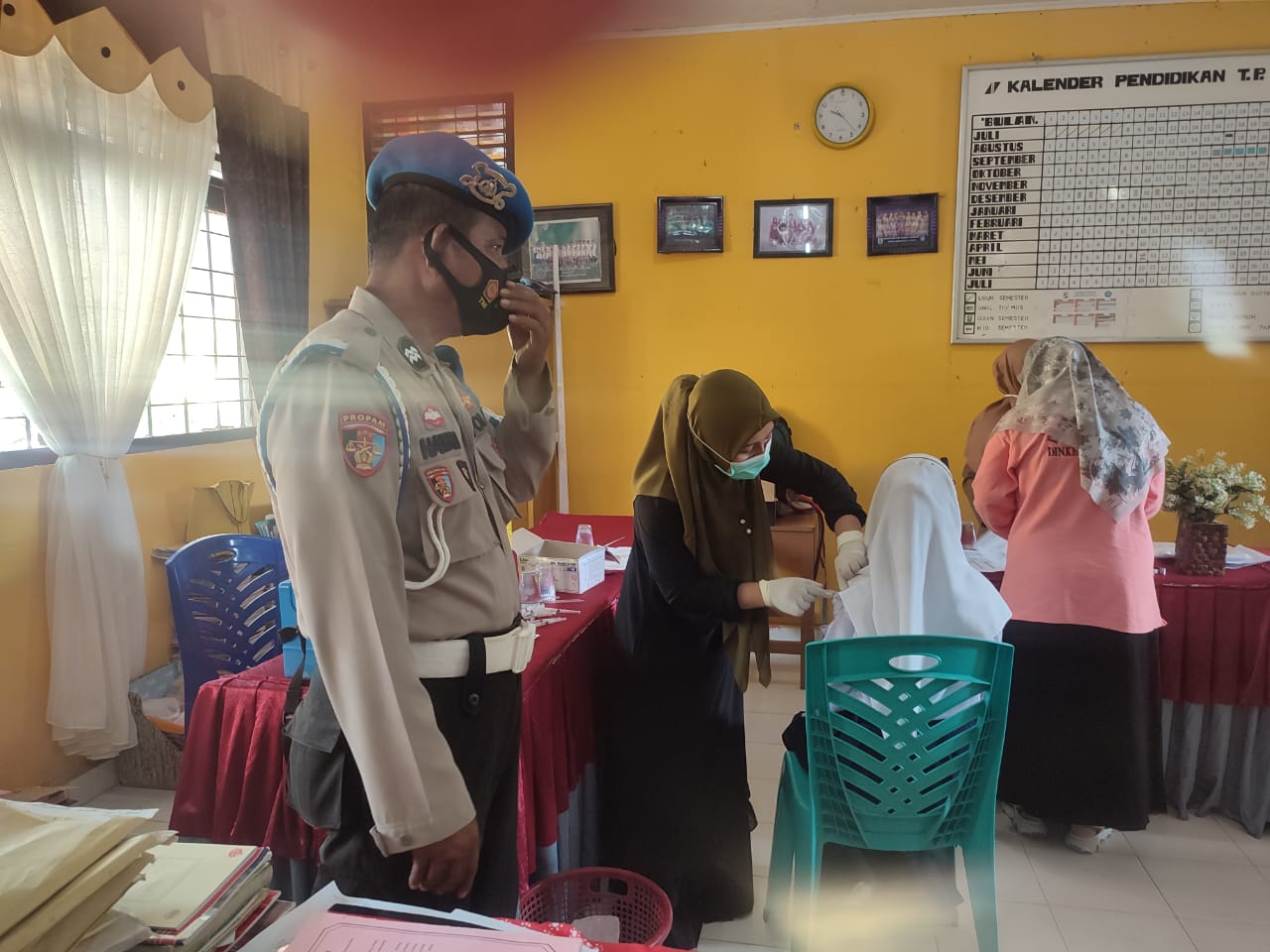 Percepatan Vaksinasi Covid-19, Polsek Langgam Pantau Giat Vaksinasi di Dua Lokasi