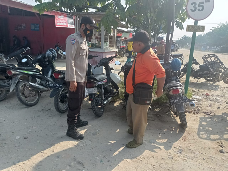 Polsek Langgam Gelar Patroli C3 dan Sosialisasi Pencegahan Covid-19 di Desa Segati