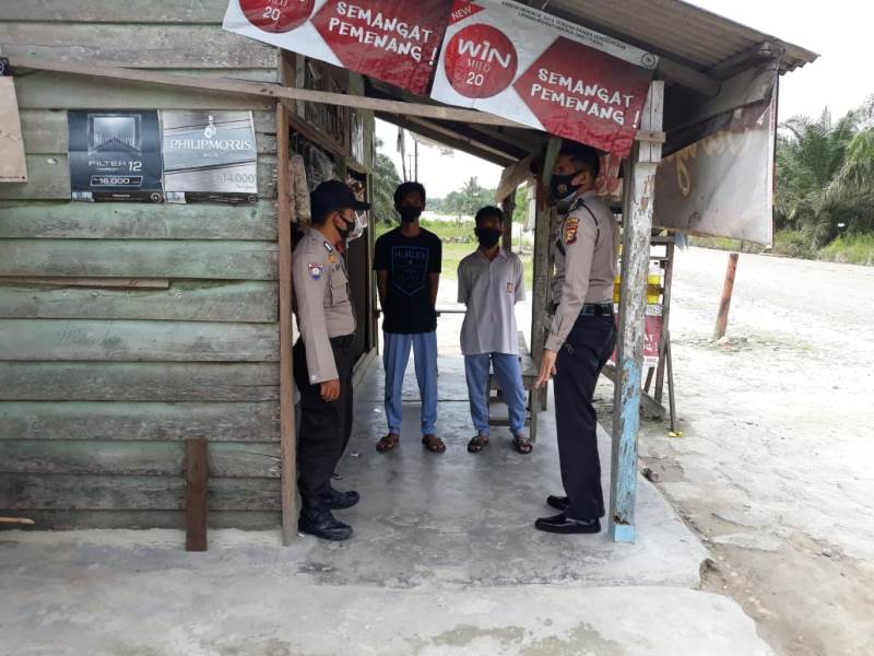 Cegah Covid-19, Polsubsektor Pelalawan Terus Lakukan Pendisiplinan Masyarakat