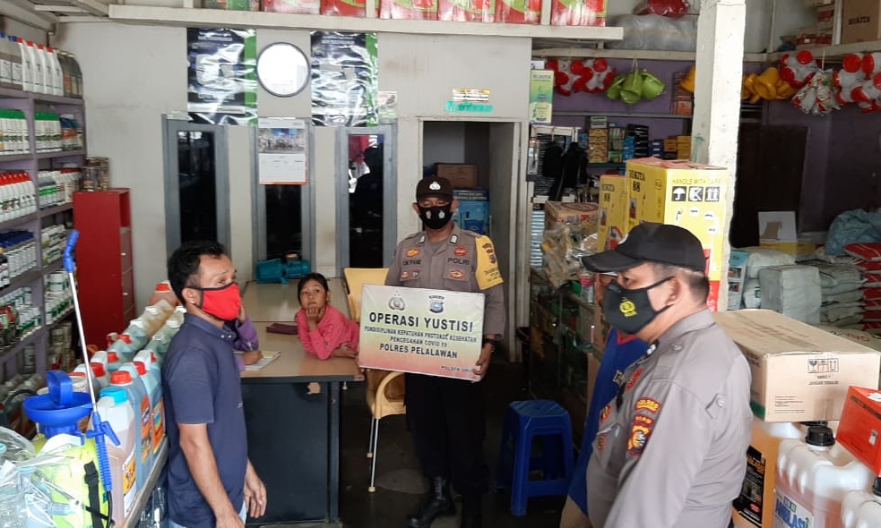 Polsek Ukui Sosialisasikan Pergubri dan Perbup Pelalawan tentang Penerapan Disiplin Prokes