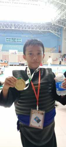 Murid Mi A'ddinulhaq Sungai Langsat, Sazam Alfikri Raih Medali Emas di Kejuaraan Pencak Silat Champion Ship Bertuah Cup Open 1